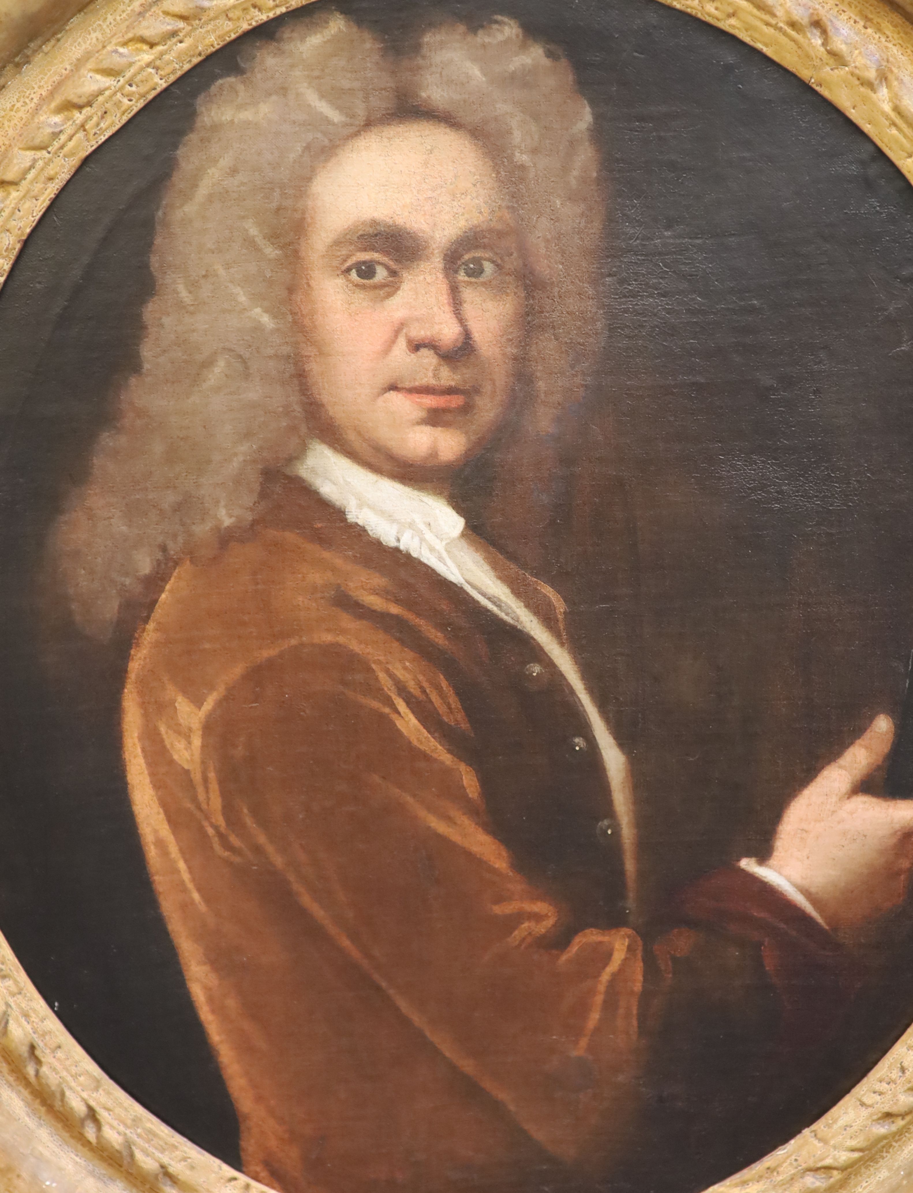School of Sir Godfrey Kneller (1646-1723) Portrait of a gentleman holding a set of drawing instruments 29 x 24.5in.